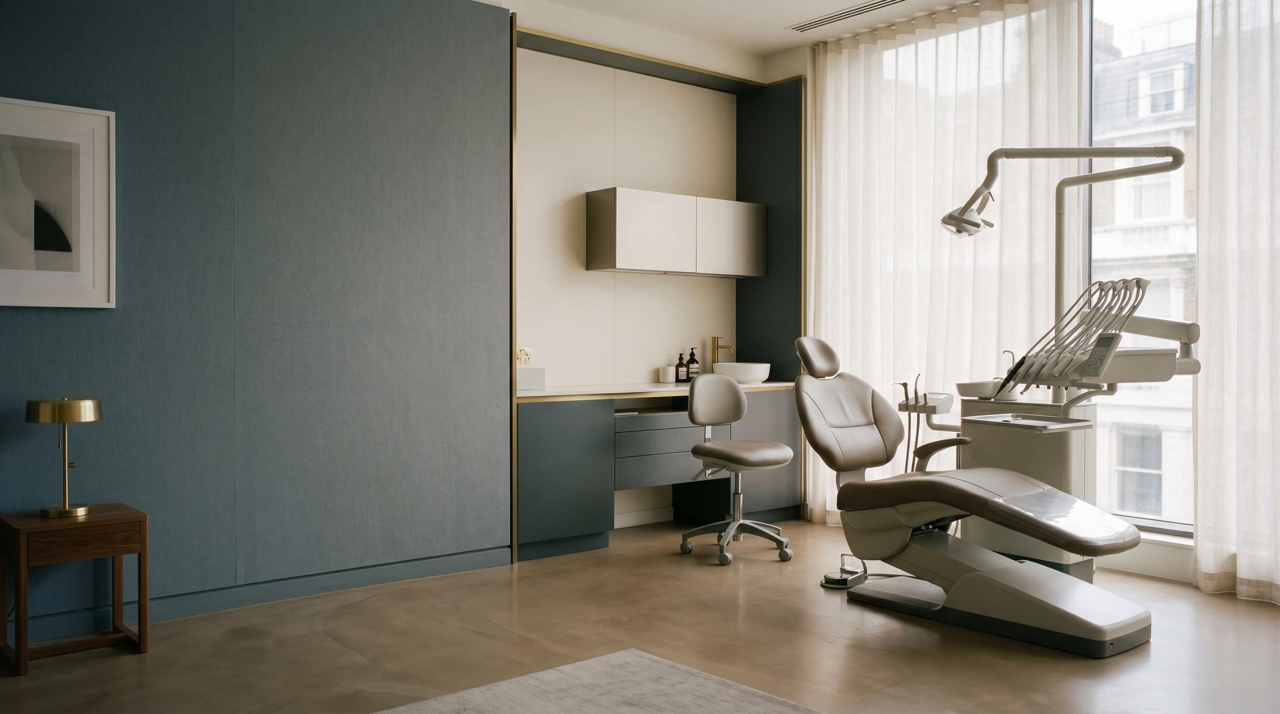 The calm treatment room of the Tsim Sha Tsui dental practice in soft daylight.